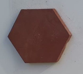 Pieza hexagonal rojiza de mosaico Nolla original